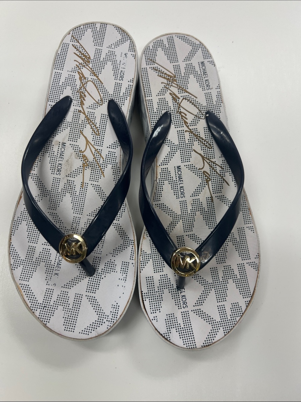 Michael Kors Navy and White Logo Flip Flops with Gold MK Medallion